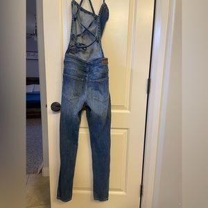 SNEAK PEEK CRISS CROSS BACK OVERALL SKINNY JEANS